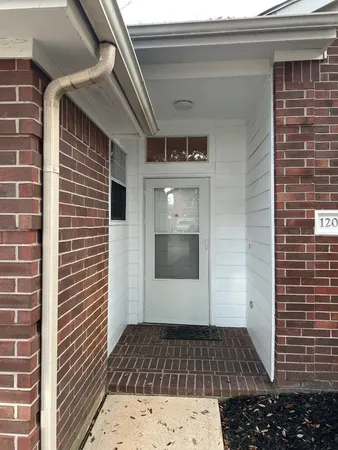 a view of a house with a white door