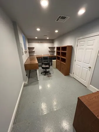 a view of a livingroom with chairs