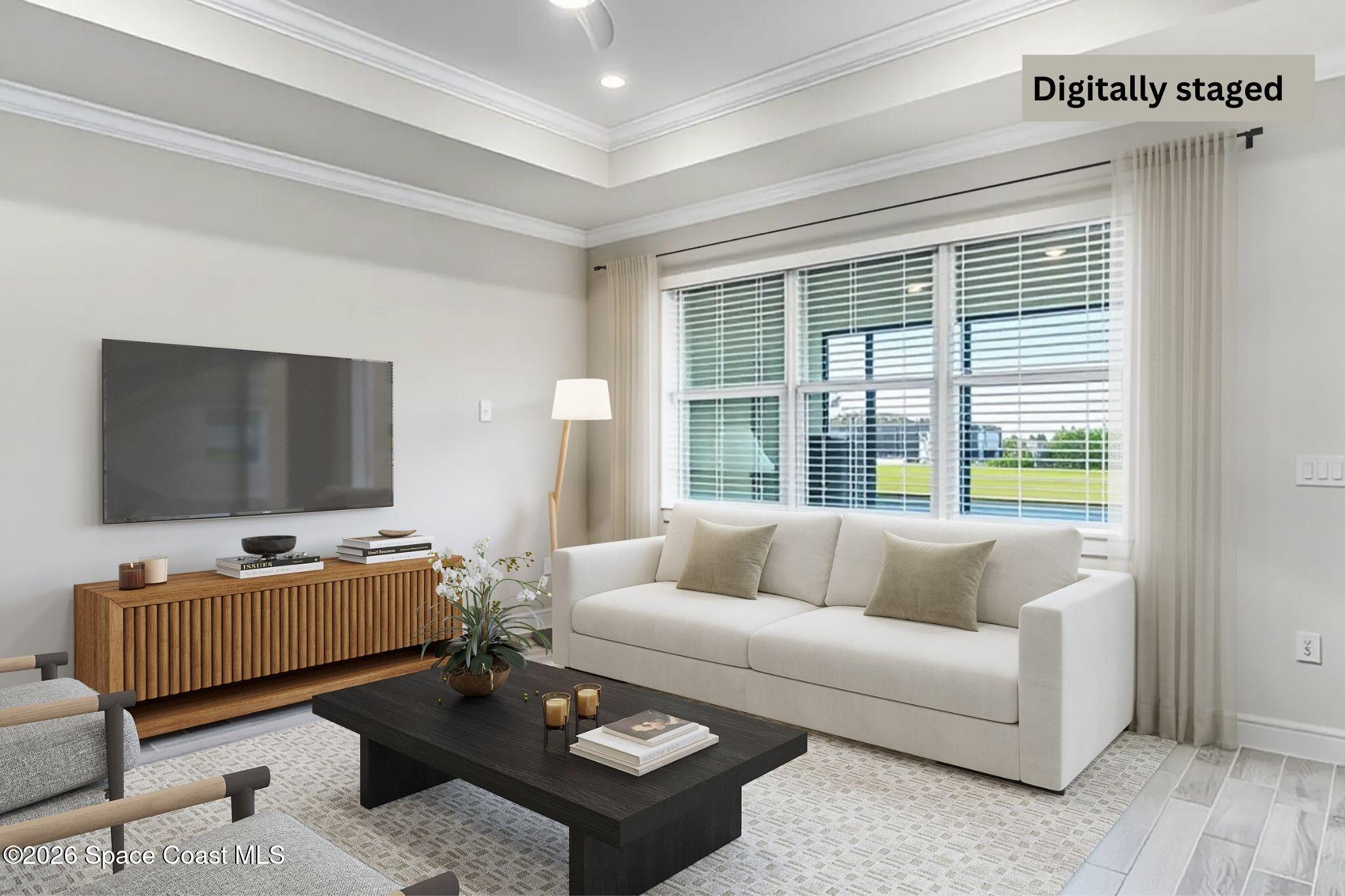 3032 Tidepool Place Melbourne, FL 32940 - Photo 15 of 67 a living room with furniture and a flat screen tv
