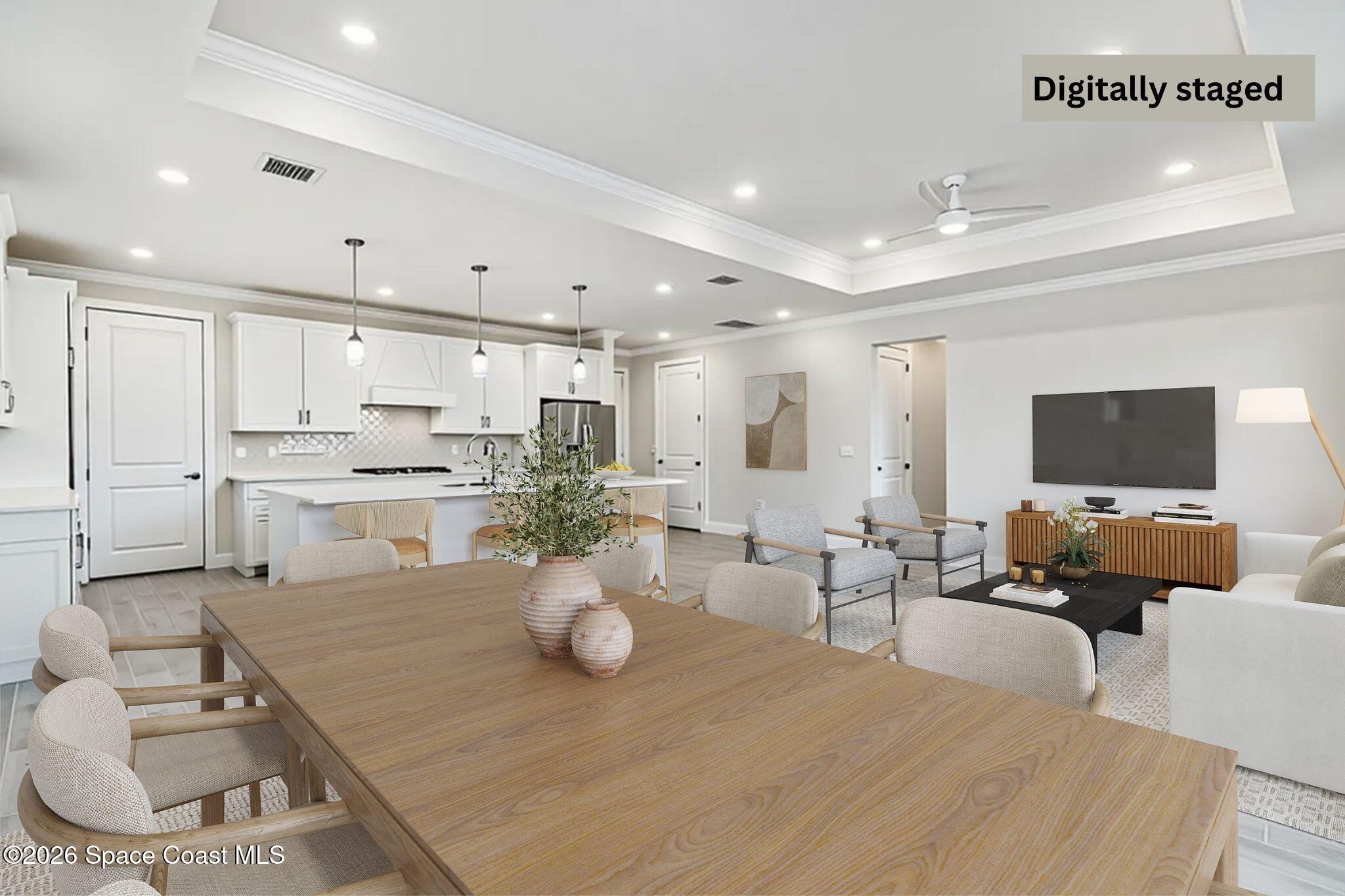 3032 Tidepool Place Melbourne, FL 32940 - Photo 16 of 67 a living room with lots of furniture and view of kitchen