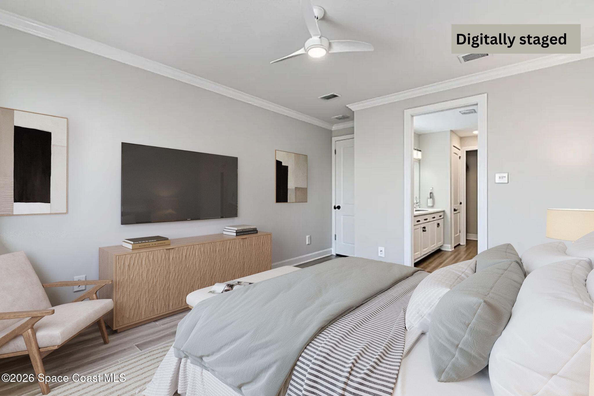 3032 Tidepool Place Melbourne, FL 32940 - Photo 19 of 67 a bedroom with a bed and a flat screen tv