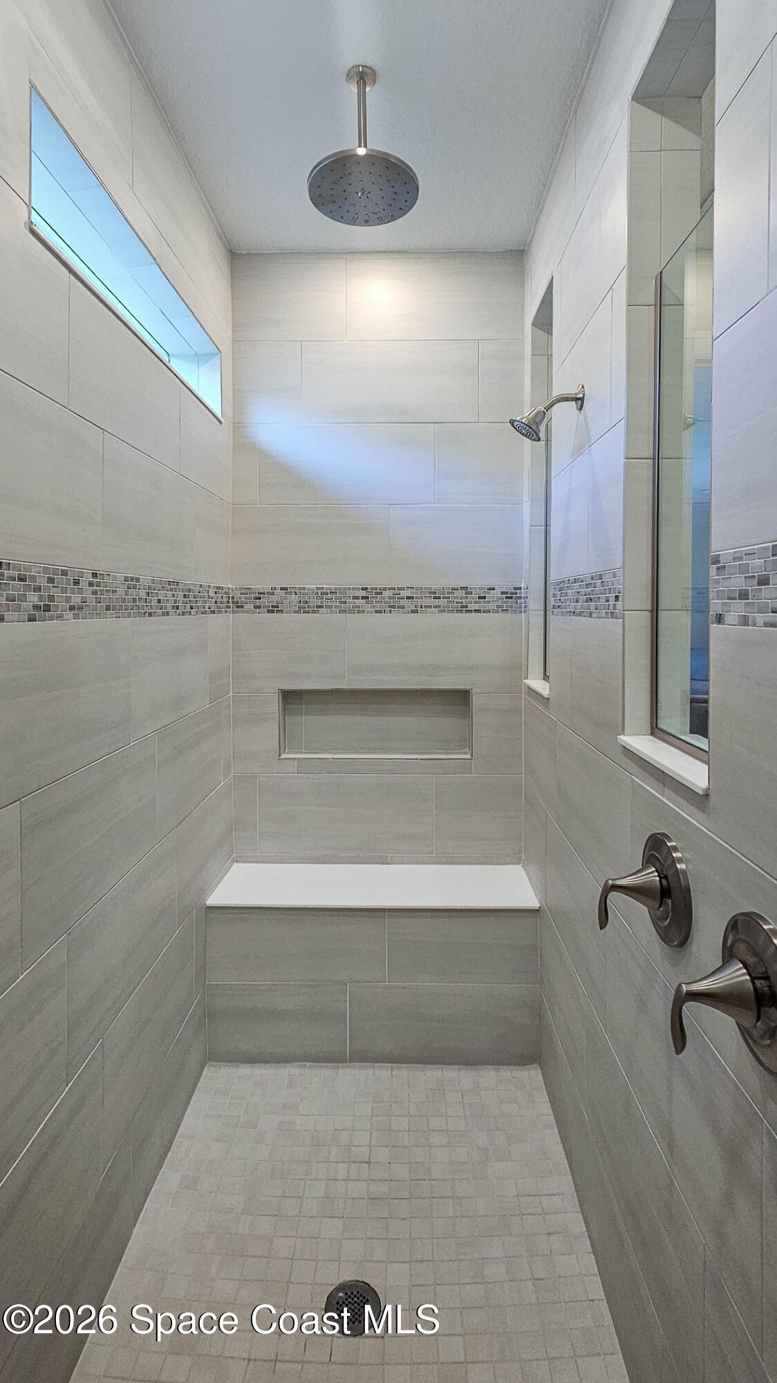 3032 Tidepool Place Melbourne, FL 32940 - Photo 22 of 67 a bathroom with a bathtub and a shower