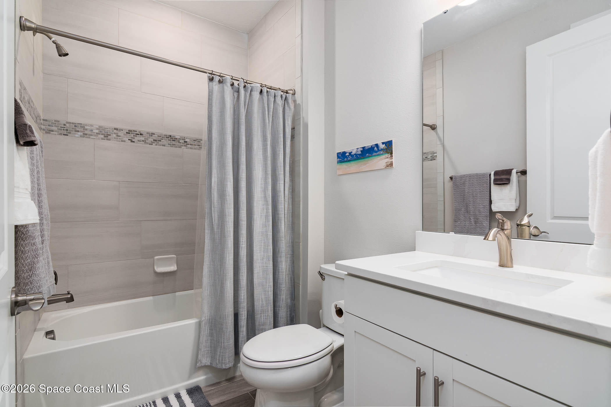 3032 Tidepool Place Melbourne, FL 32940 - Photo 24 of 67 a bathroom with a sink toilet and shower