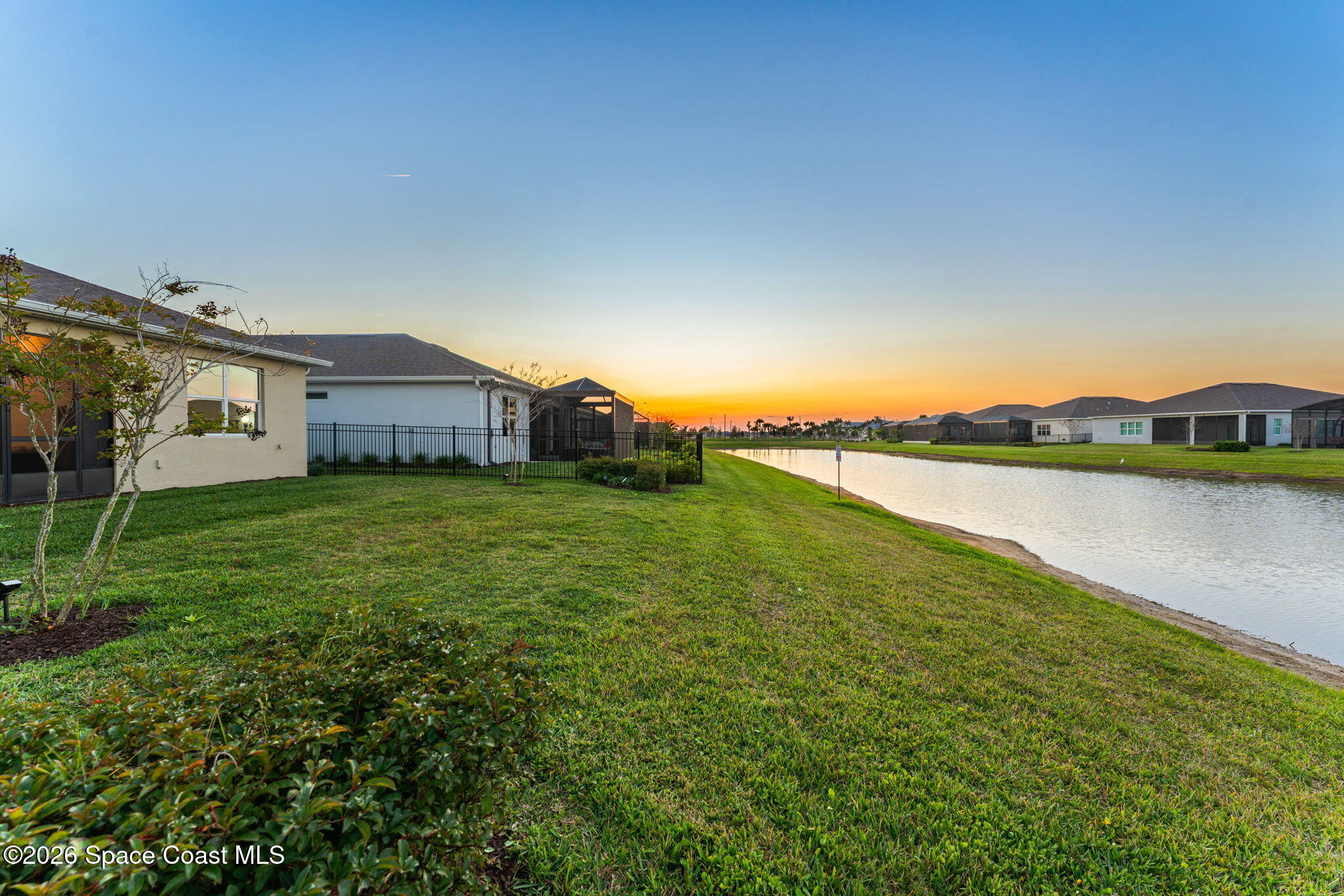 3032 Tidepool Place Melbourne, FL 32940 - Photo 31 of 67 a view of a house with a yard and a large window