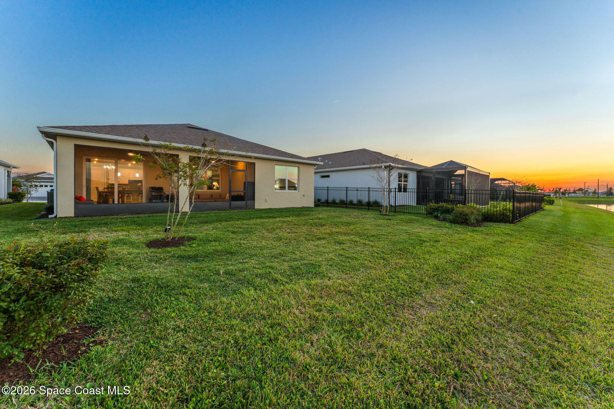 3032 Tidepool Place Melbourne, FL 32940 - Photo 33 of 67 a view of a house with a big yard and large trees