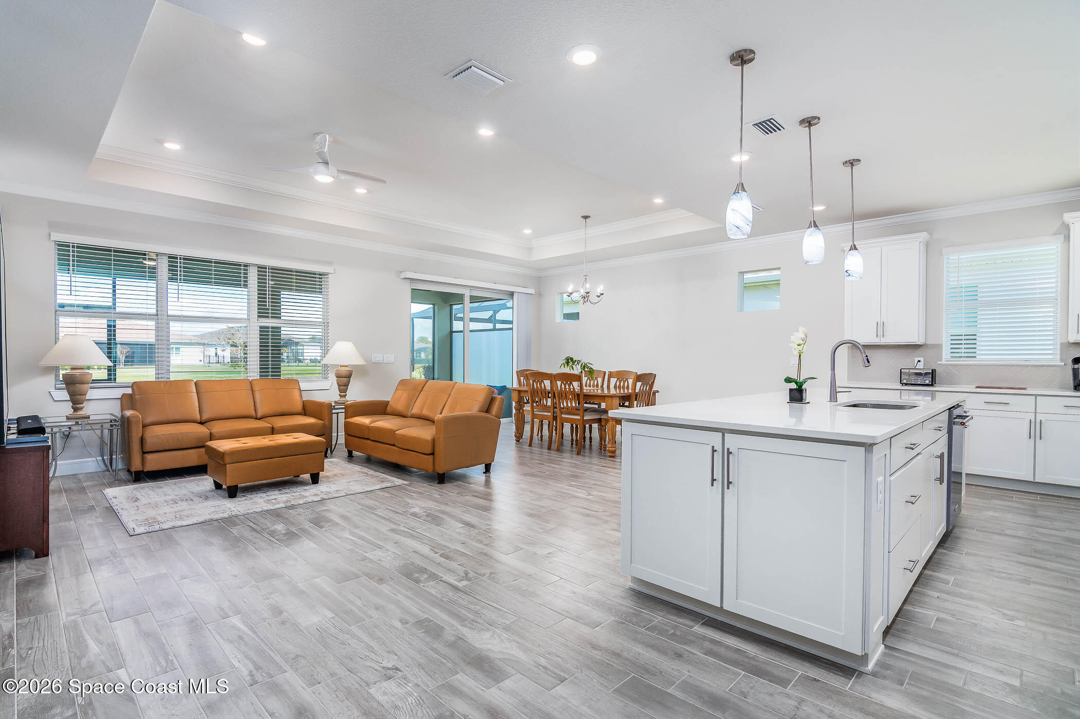 3032 Tidepool Place Melbourne, FL 32940 - Photo 43 of 67 a kitchen with sink and view of living room