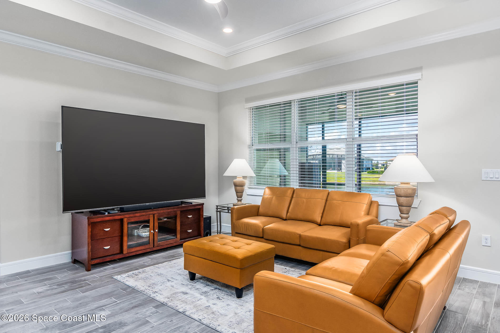 3032 Tidepool Place Melbourne, FL 32940 - Photo 45 of 67 a living room with furniture and a flat screen tv