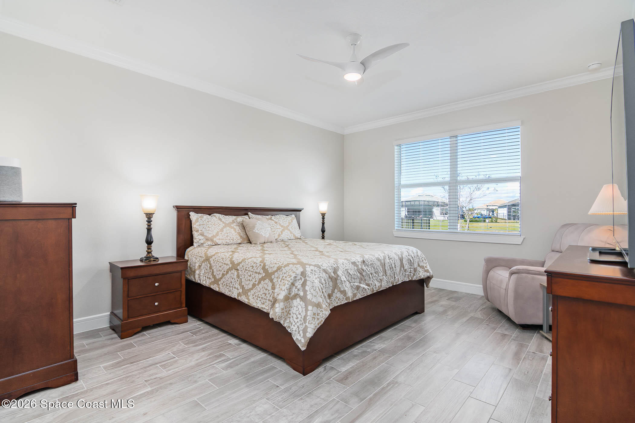 3032 Tidepool Place Melbourne, FL 32940 - Photo 46 of 67 a bedroom with a bed and a window