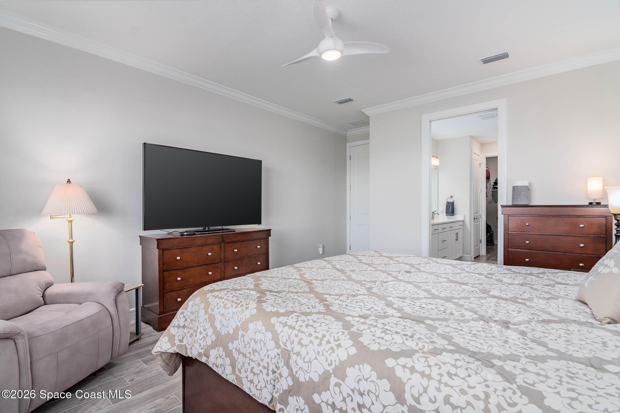 3032 Tidepool Place Melbourne, FL 32940 - Photo 47 of 67 a bedroom with a bed and a flat screen tv