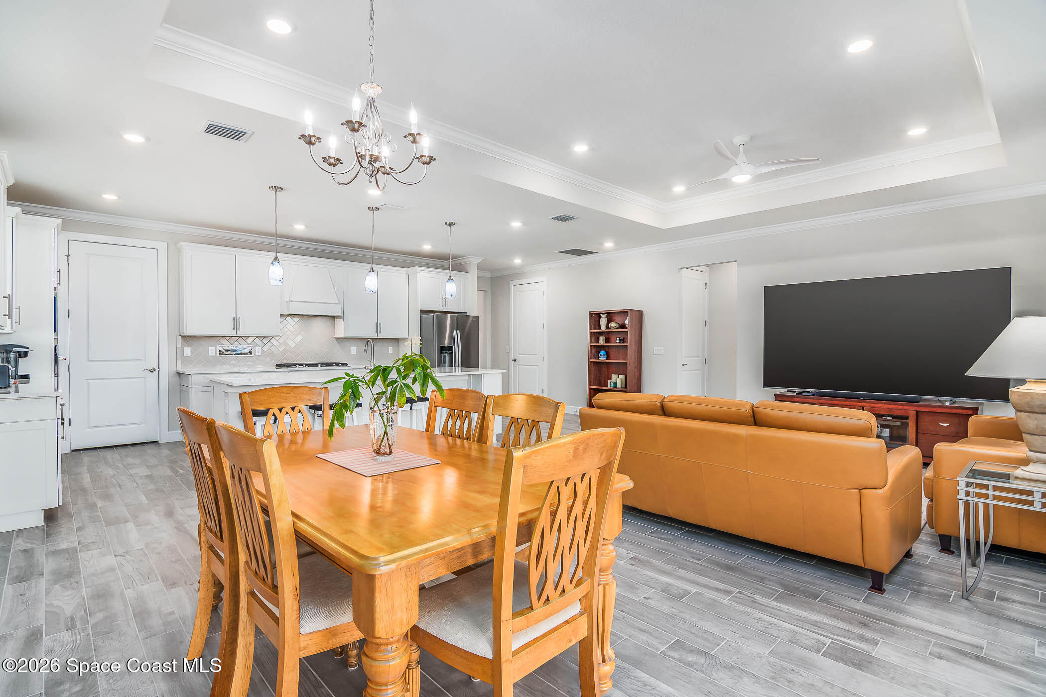3032 Tidepool Place Melbourne, FL 32940 - Photo 51 of 67 a view of a dining room with furniture and wooden floor