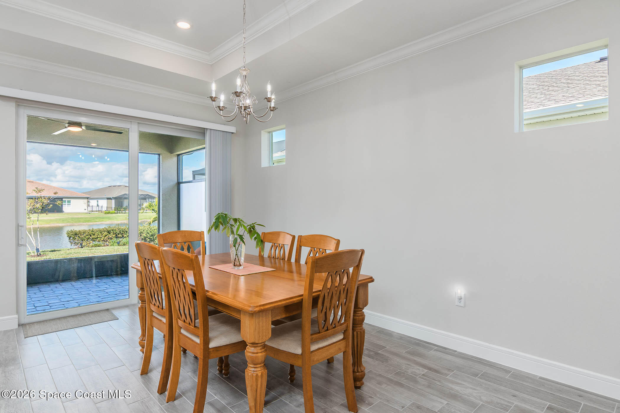 3032 Tidepool Place Melbourne, FL 32940 - Photo 52 of 67 a dining room with furniture and window