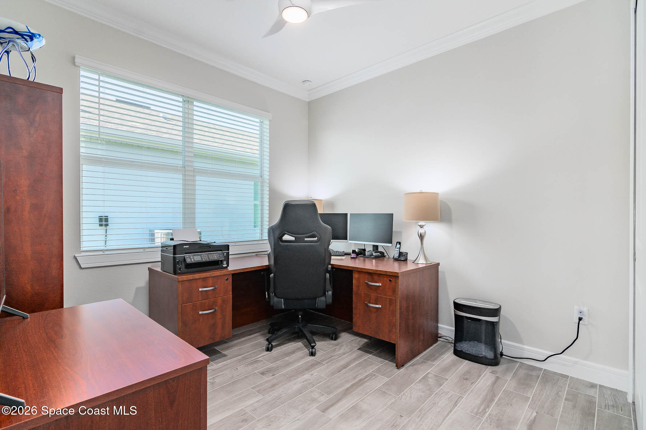 3032 Tidepool Place Melbourne, FL 32940 - Photo 53 of 67 a view of a workspace with furniture and a window