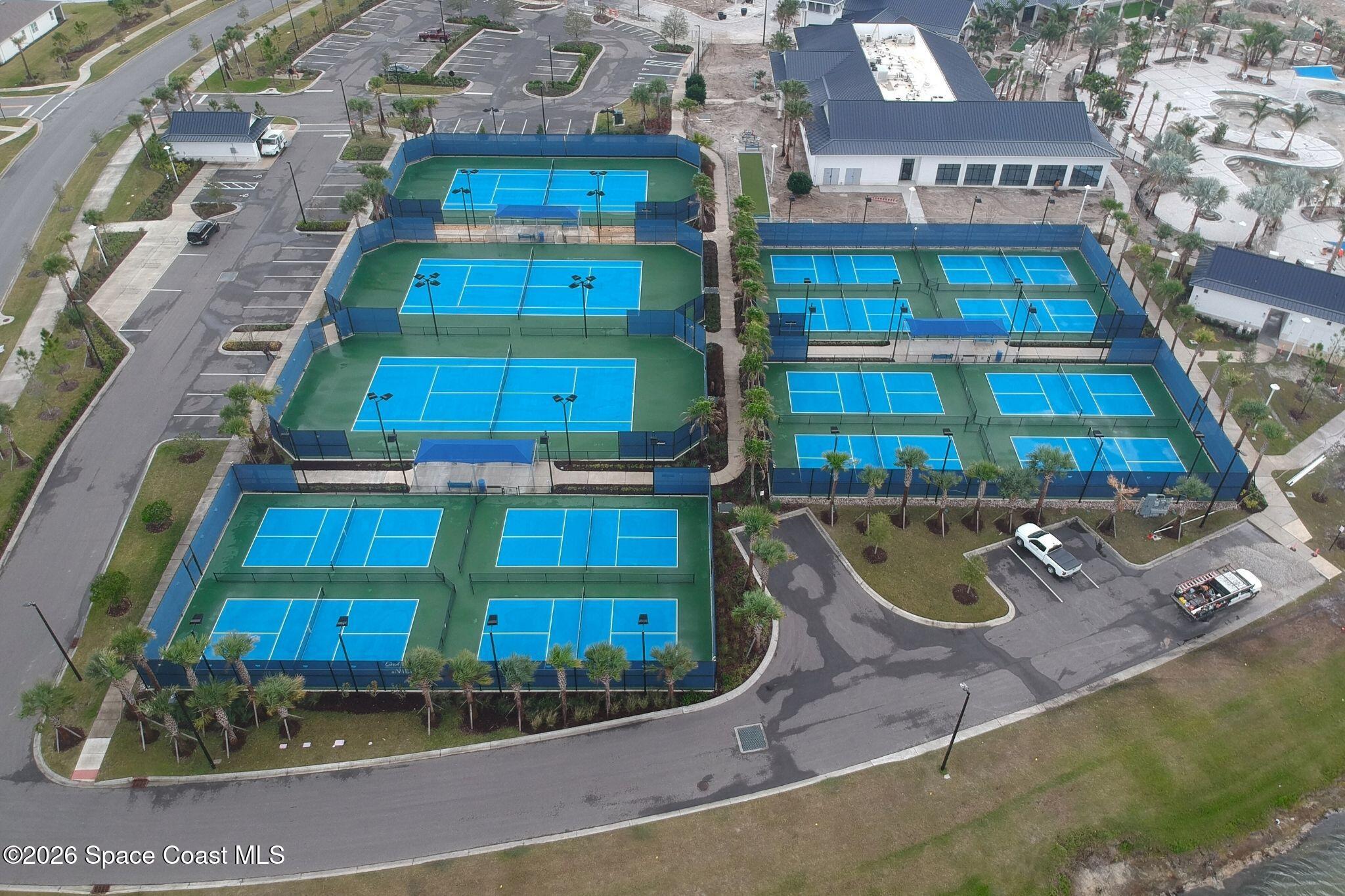 3032 Tidepool Place Melbourne, FL 32940 - Photo 65 of 67 an aerial view of a residential apartment building with a yard