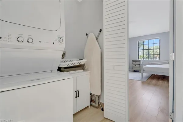 a close view of a utility room with washer and dryer