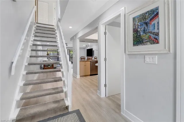 a view of an entryway with wooden floor