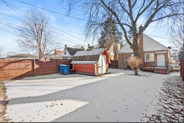 a front view of a house with a snow in front of house