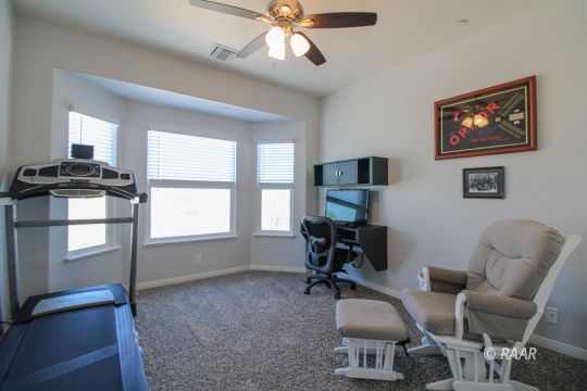 428 Scott Street Ridgecrest, CA 93555 - Photo 22 of 35 a workspace with furniture ceiling fan and window