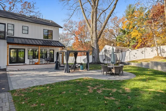 a view of a park with bench and tables