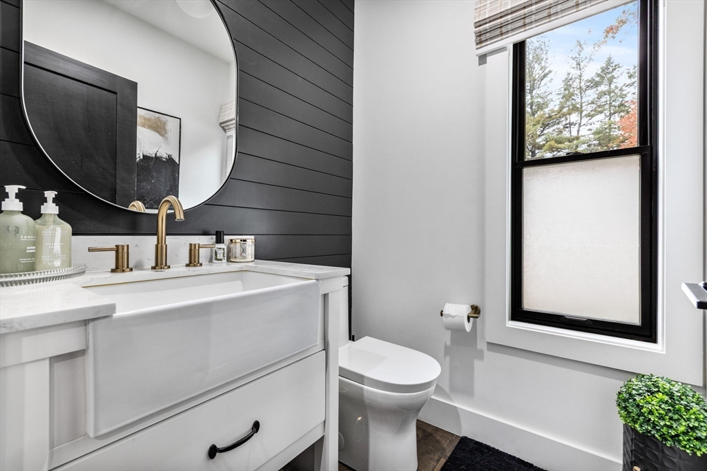 973 Main Street Lynnfield, MA 01940 - Photo 13 of 37 a bathroom with a toilet sink and mirror