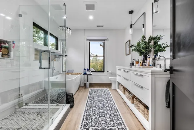 a white bath tub sitting next to a window