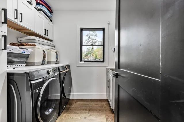 a bedroom with a large bed and a large window