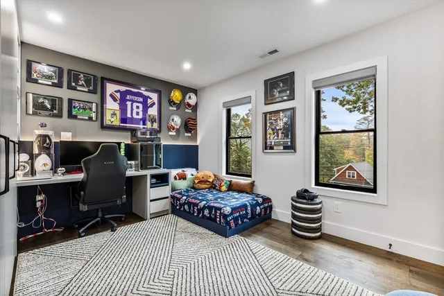 a bedroom with a bed and a cabinets