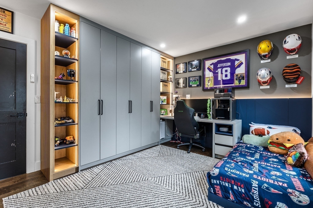 973 Main Street Lynnfield, MA 01940 - Photo 26 of 37 a bedroom with a bed and a cabinets