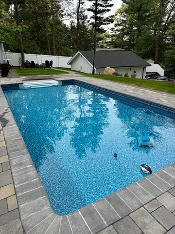 a view of a swimming pool with an outdoor space