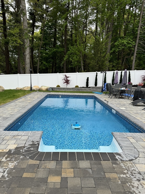 973 Main Street Lynnfield, MA 01940 - Photo 37 of 37 a view of a swimming pool with an outdoor space