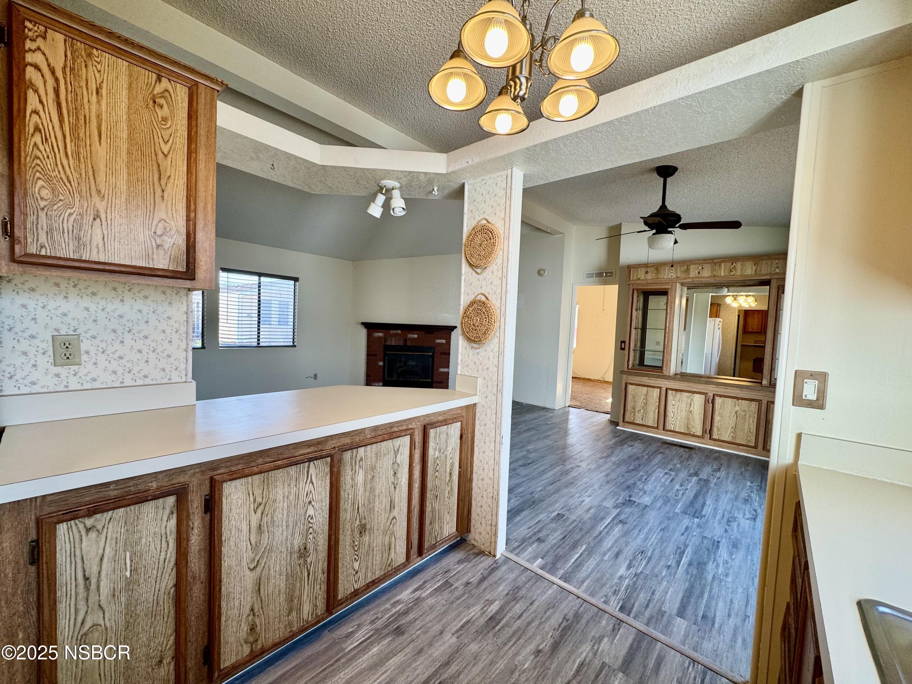 1317 V Street, Unit 58 Lompoc, CA 93436 - Photo 11 of 34 a view of an entryway with wooden floor