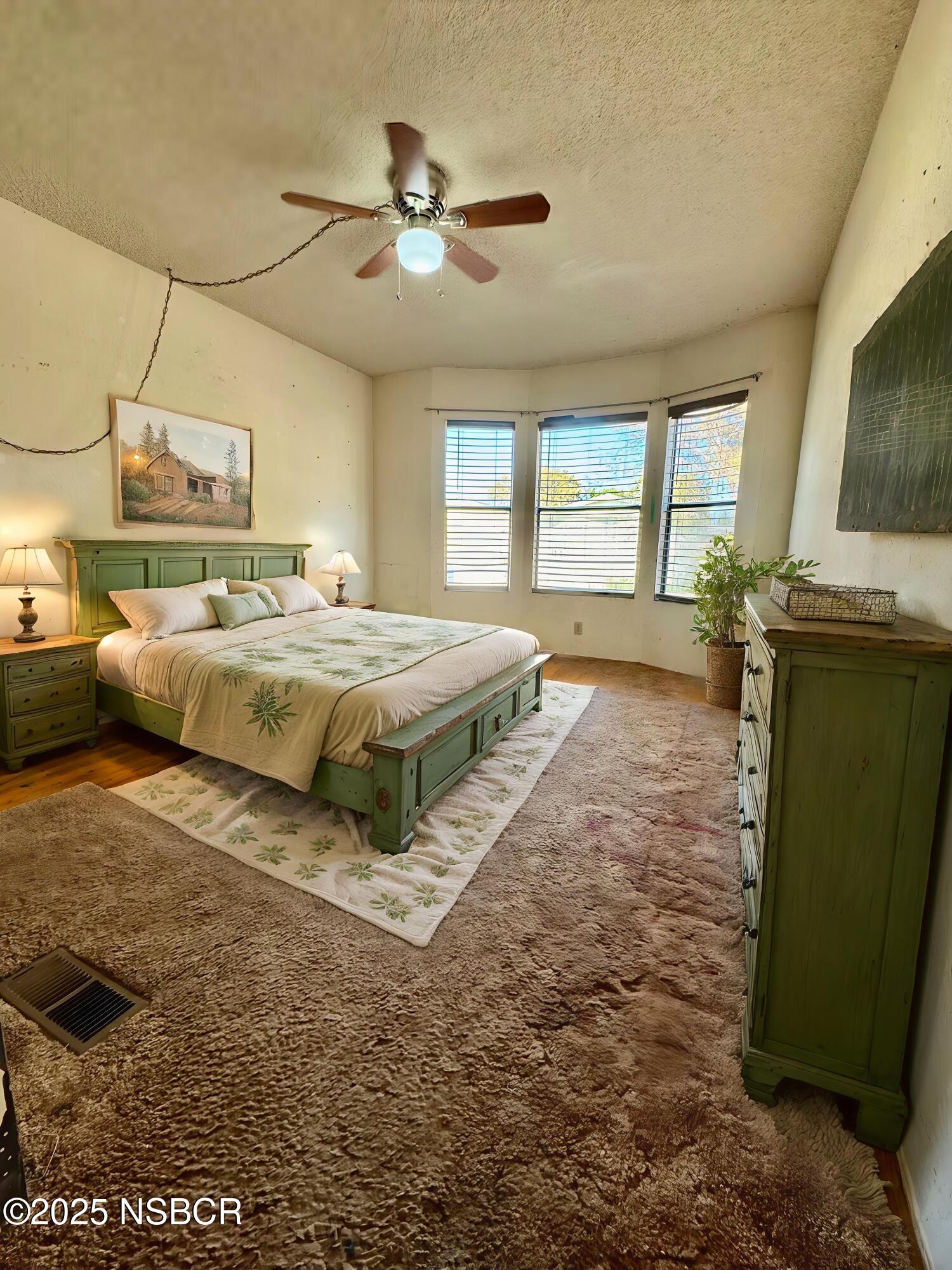 1317 V Street, Unit 58 Lompoc, CA 93436 - Photo 19 of 34 a bed room with a bed furniture and a large window