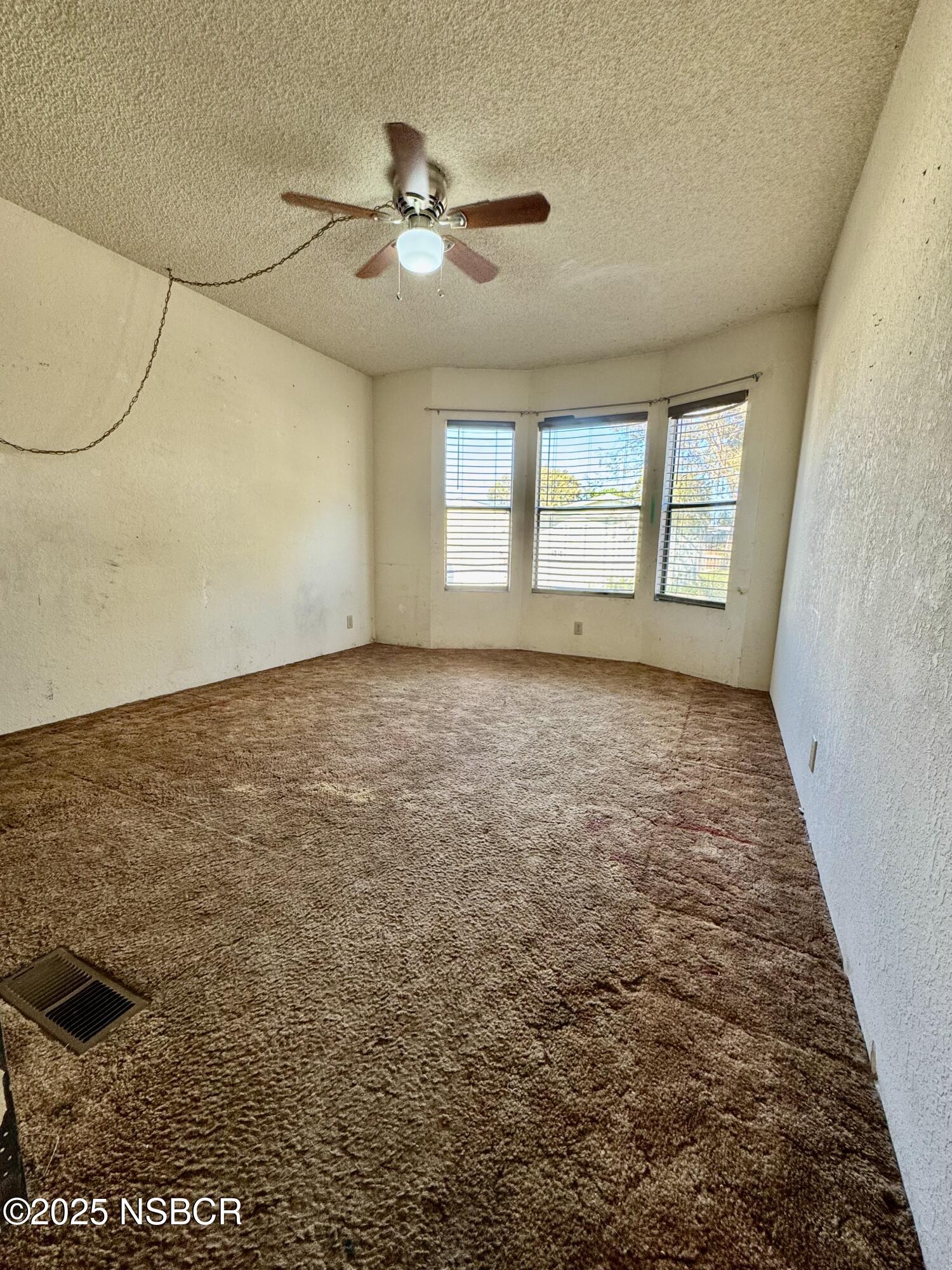 1317 V Street, Unit 58 Lompoc, CA 93436 - Photo 20 of 34 a view of an empty room with a window
