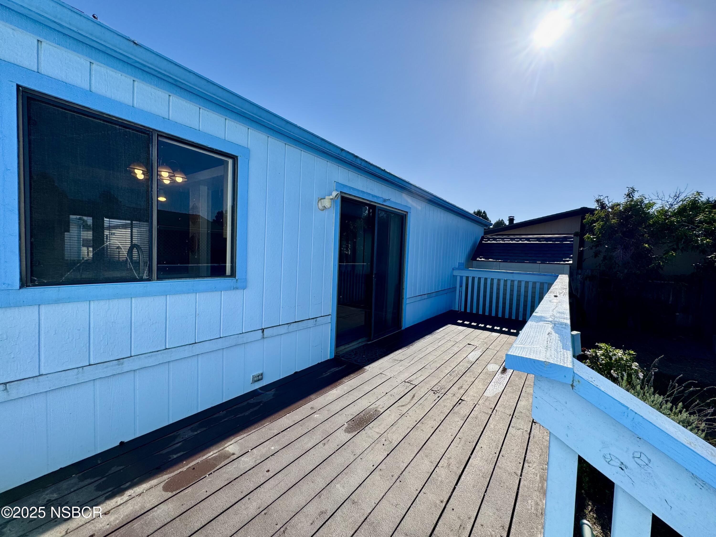 1317 V Street, Unit 58 Lompoc, CA 93436 - Photo 24 of 34 a bedroom with a bed and a potted plant
