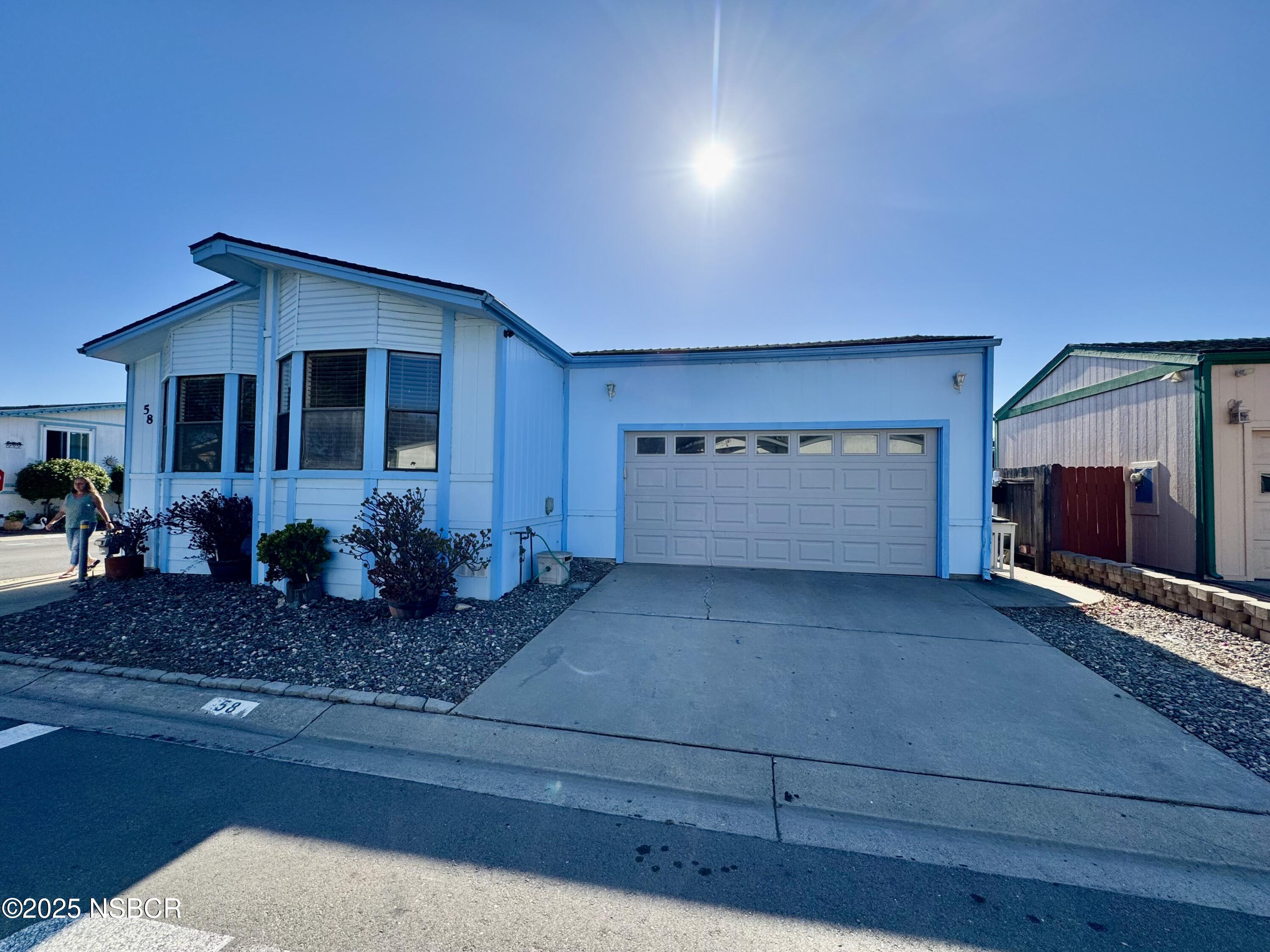 1317 V Street, Unit 58 Lompoc, CA 93436 - Photo 3 of 34 a view of a house with backyard and sitting area