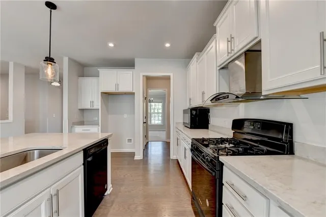 an empty room with windows and entryway
