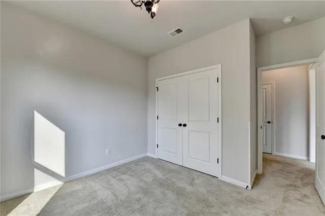 a view of a chandelier fan and entryway