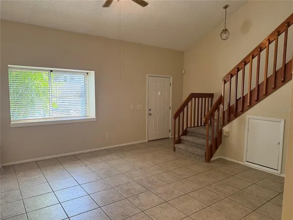 an empty room with windows and closet