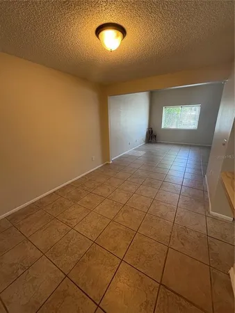 wooden floor in an entryway with a window