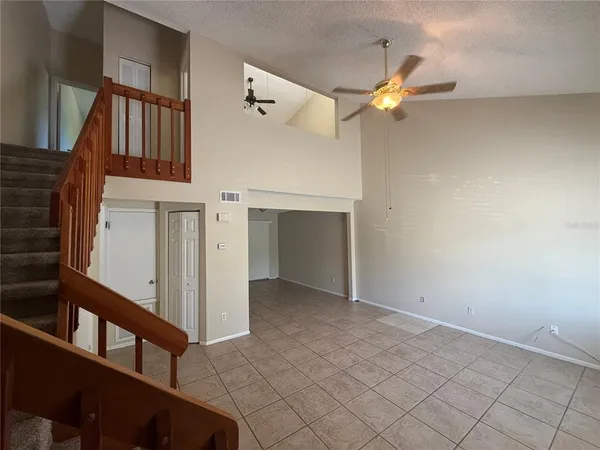 a view of an empty room and a window