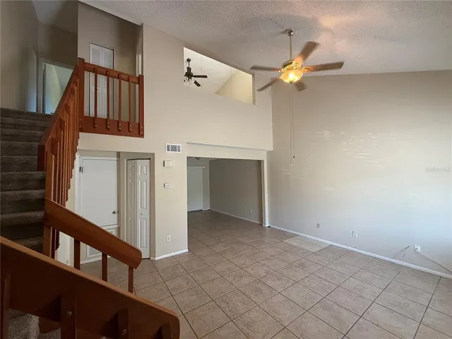 a view of an empty room and a window