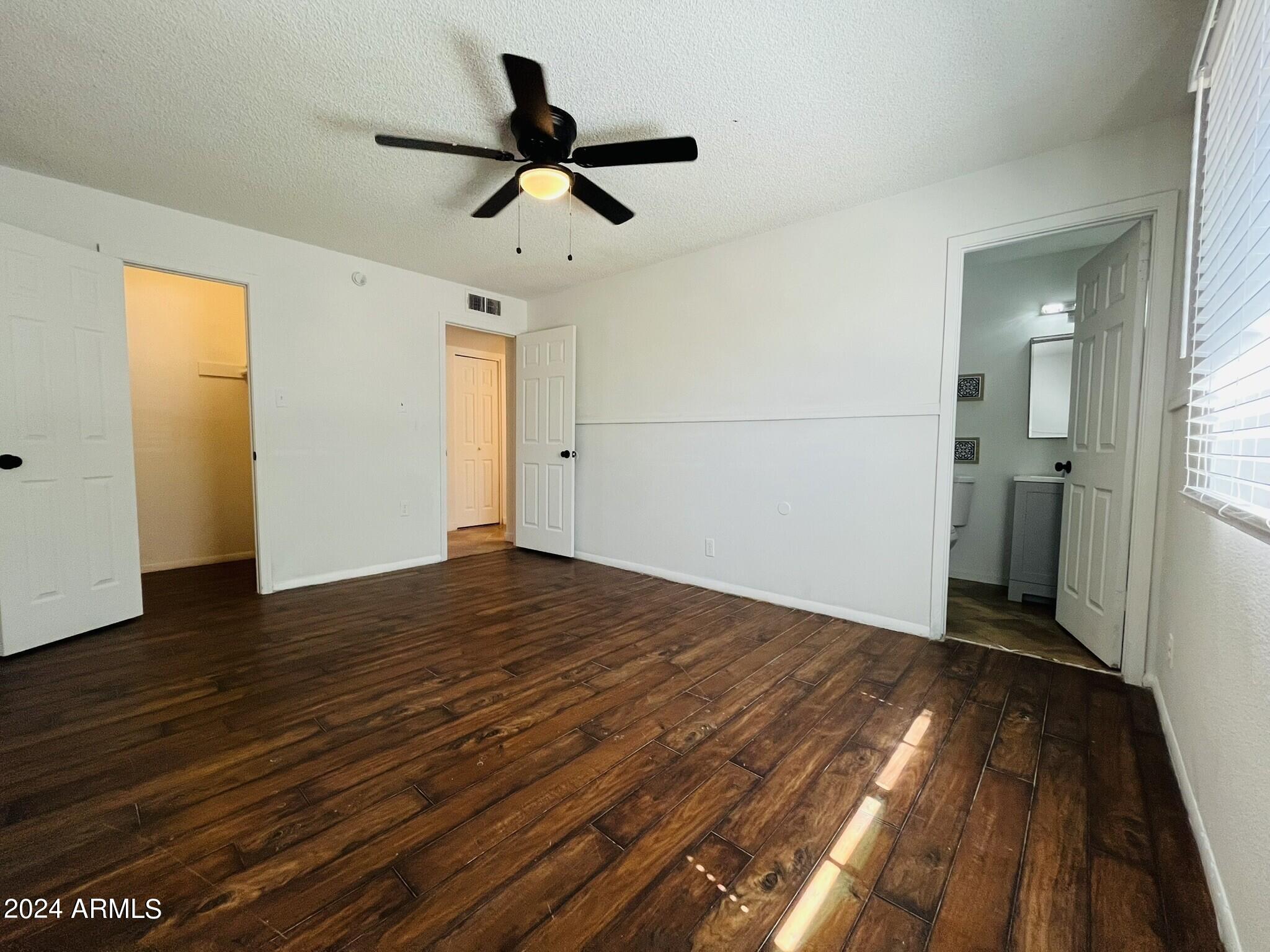 5154 West Berkeley Road Phoenix, AZ 85035 - Photo 13 of 19 a view of empty room with wooden floor