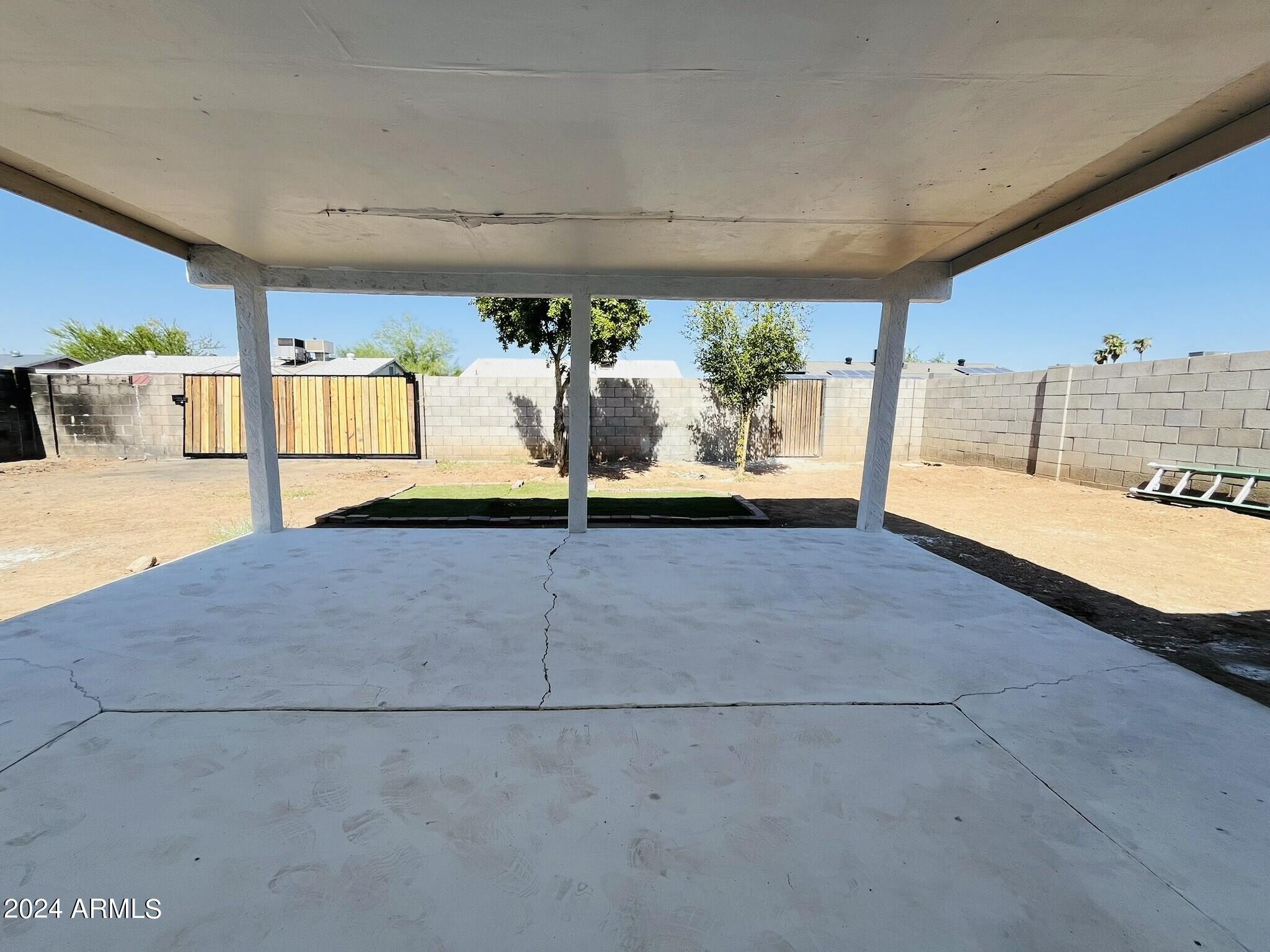 5154 West Berkeley Road Phoenix, AZ 85035 - Photo 16 of 19 a view of a living room and a garage