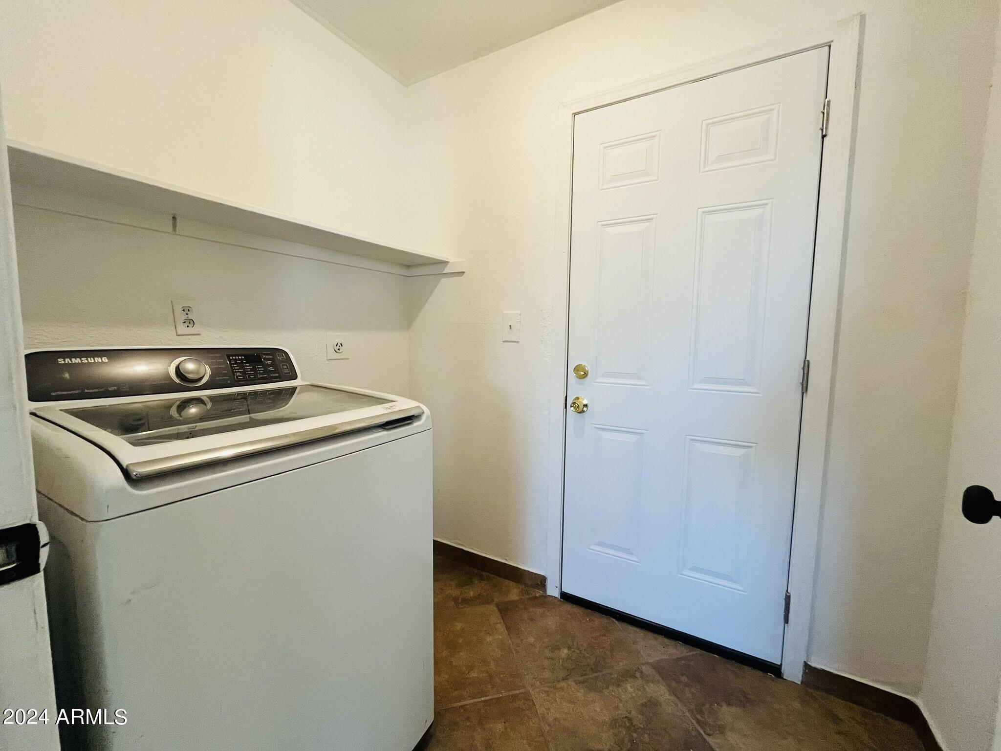 5154 West Berkeley Road Phoenix, AZ 85035 - Photo 18 of 19 a utility room with dryer and washer
