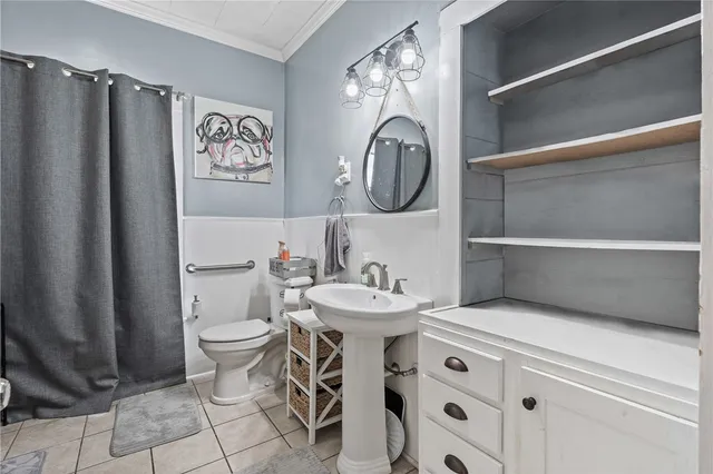a bathroom with a tub a sink and a mirror