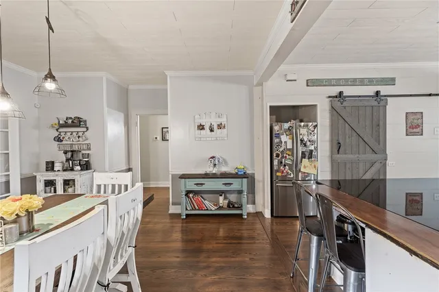 a kitchen with granite countertop a stove and wooden floor