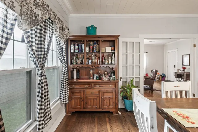 a open kitchen with stainless steel appliances granite countertop a stove and a wooden floors