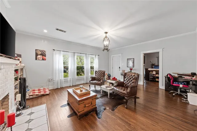 a bedroom with bed and a chandelier