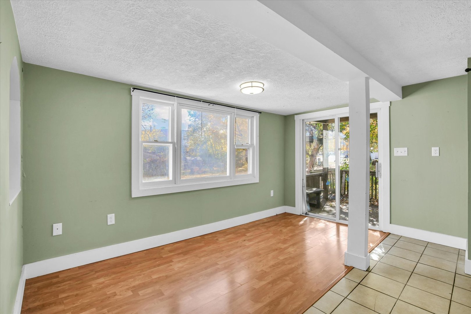 107 Byron Street Sidney, IL 61877 - Photo 16 of 31 a view of an empty room with glass door and a window