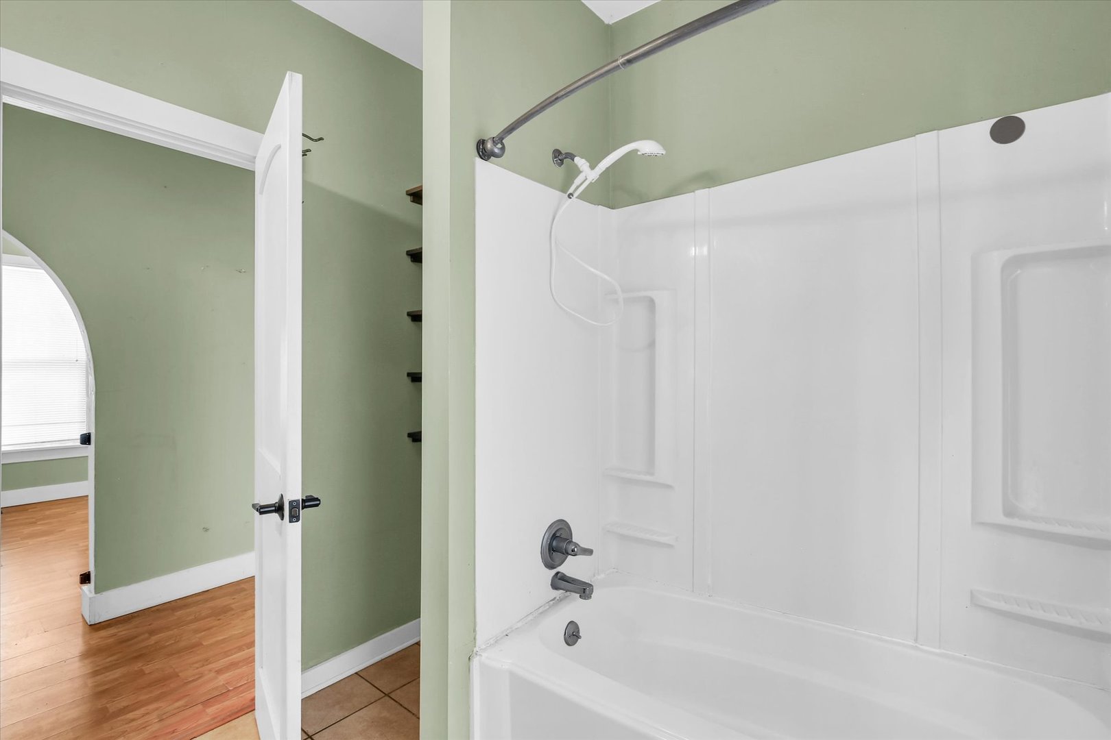 107 Byron Street Sidney, IL 61877 - Photo 20 of 31 a bathroom with a bathtub and a shower