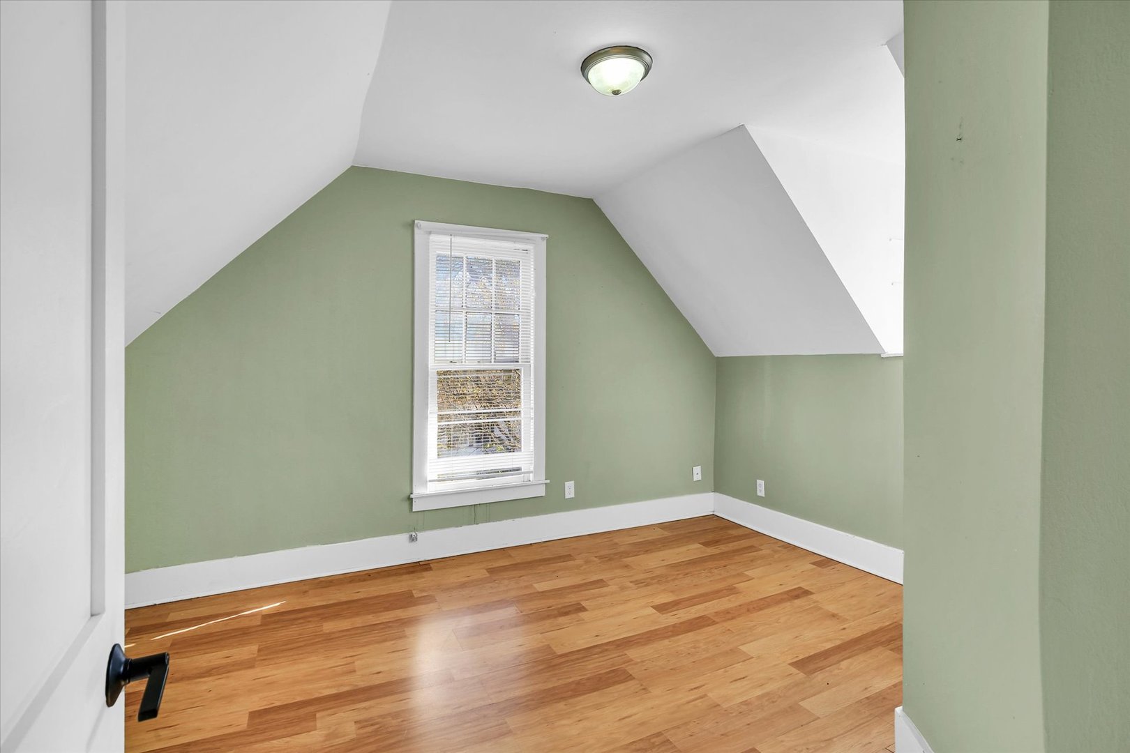 107 Byron Street Sidney, IL 61877 - Photo 23 of 31 an empty room with wooden floor and windows